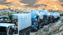 شاحنات تحمل سوريين مرحلين من لبنان، البقاع 14 مايو 2024 (فرانس برس)