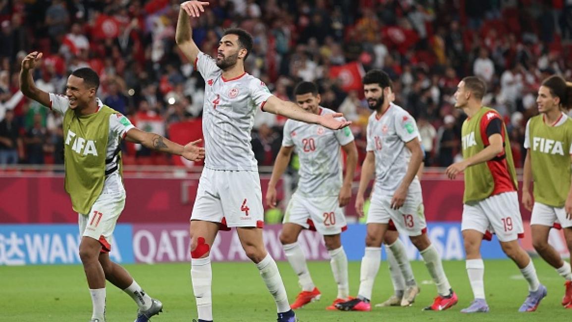 Tunisia's players celebrate their win with the fans during the FIFA Arab Cup 2021 group B football match between Tunisia and United Arab Emirates at the Al-Thumama Stadium in the capital city of Doha on December 6, 2021. (Photo by KARIM JAAFAR / AFP) (Photo by KARIM JAAFAR/AFP via Getty Images)