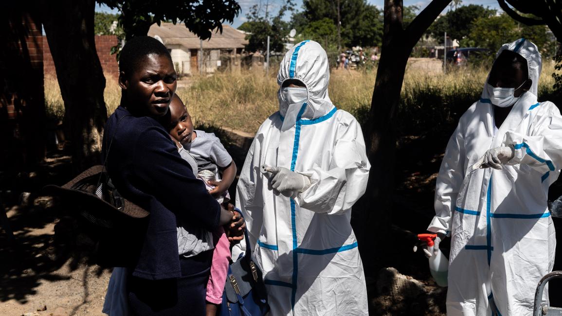 ZIMBABWE-HEALTH-VIRUS Medical personnel direct a woman and her child after having checked their temperatures while visiting on April 25, 2020, the Mpilo Hospital in Bulawayo, Zimbabwe. - The number of cases of coronavirus in Africa is currently low compared to the rest of the planet: nearly 28,000 on the continent against more than 2.7 million worldwide, according to an AFP count. (Photo by ZINYANGE AUNTONY / AFP) (Photo by ZINYANGE AUNTONY/AFP via Getty Images)