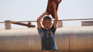 صهاريج مياه في الحسكة في سورية (أحمد الربيعي/ فرانس برس)