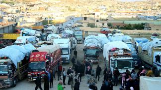شاحنات تحمل لاجئين سوريين تستعد لمغادرة لبنان، 14 مايو 2024 (فرانس برس)