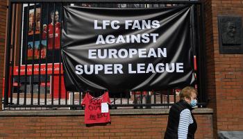 Anti-European Super League posters hang outside Anfield stadium, home of English Premier League football club Liverpool, in Liverpool, north west England on April 19, 2021. - Fan of the six Premier League clubs leading the breakaway European Super League have slammed the controversial plan, branding it the "ultimate betrayal". Liverpool, Manchester United, Arsenal, Chelsea, Manchester City and Tottenham are all involved in the new league, alongside Spanish trio Real Madrid, Barcelona, Atletico Madrid and It