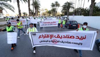 تظاهرة في طرابلس تطالب بإجراء انتخابات، ديسمبر 2021 (محمود تركية/فرانس برس)