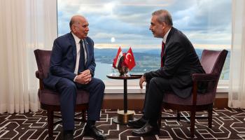 وزير الخارجية العراقي ونظيره التركي خلال لقاء بسويسرا، 15 يونيو 2024 (الأناضول)